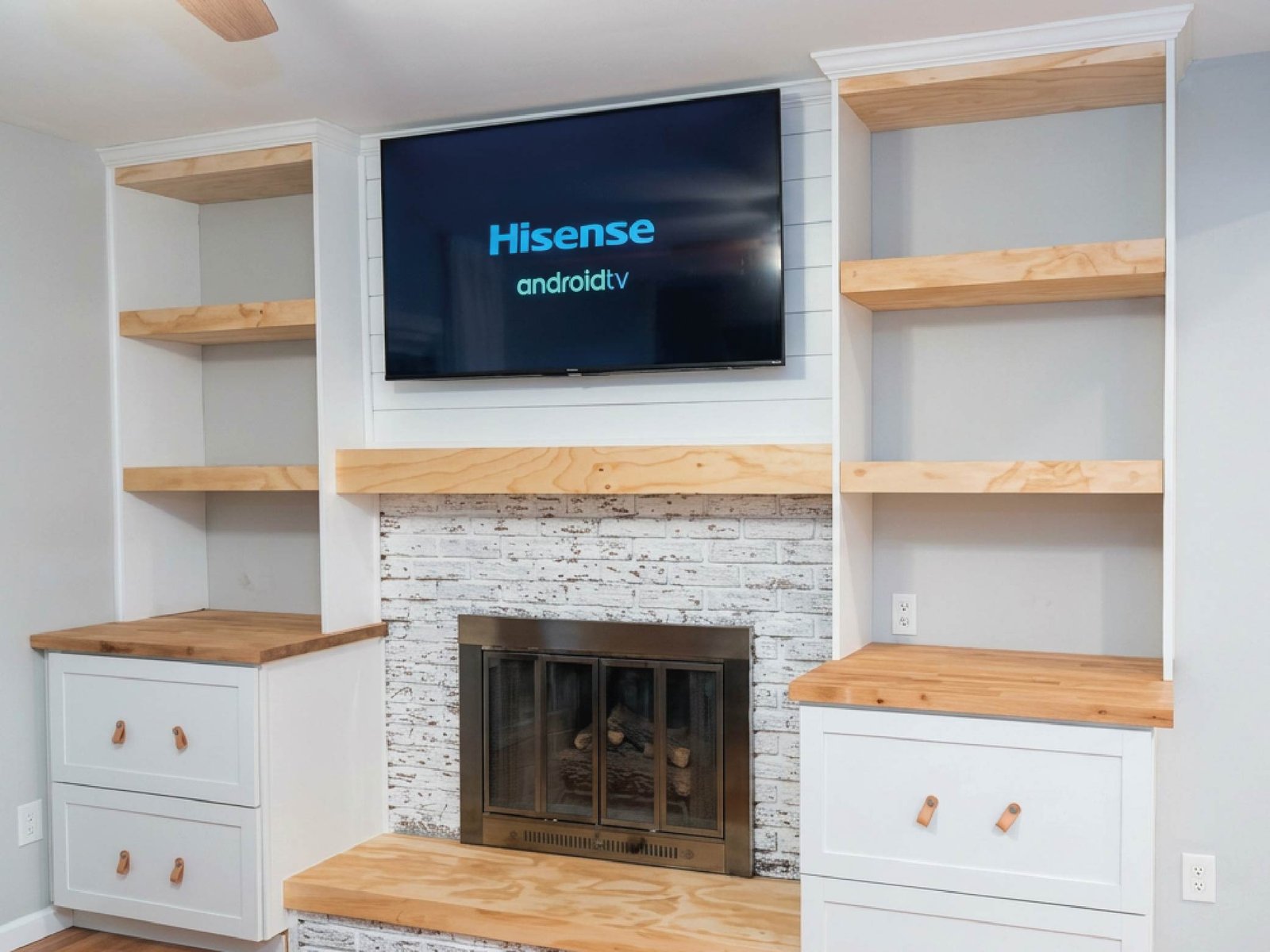 Custom built-in shelving and fireplace remodel